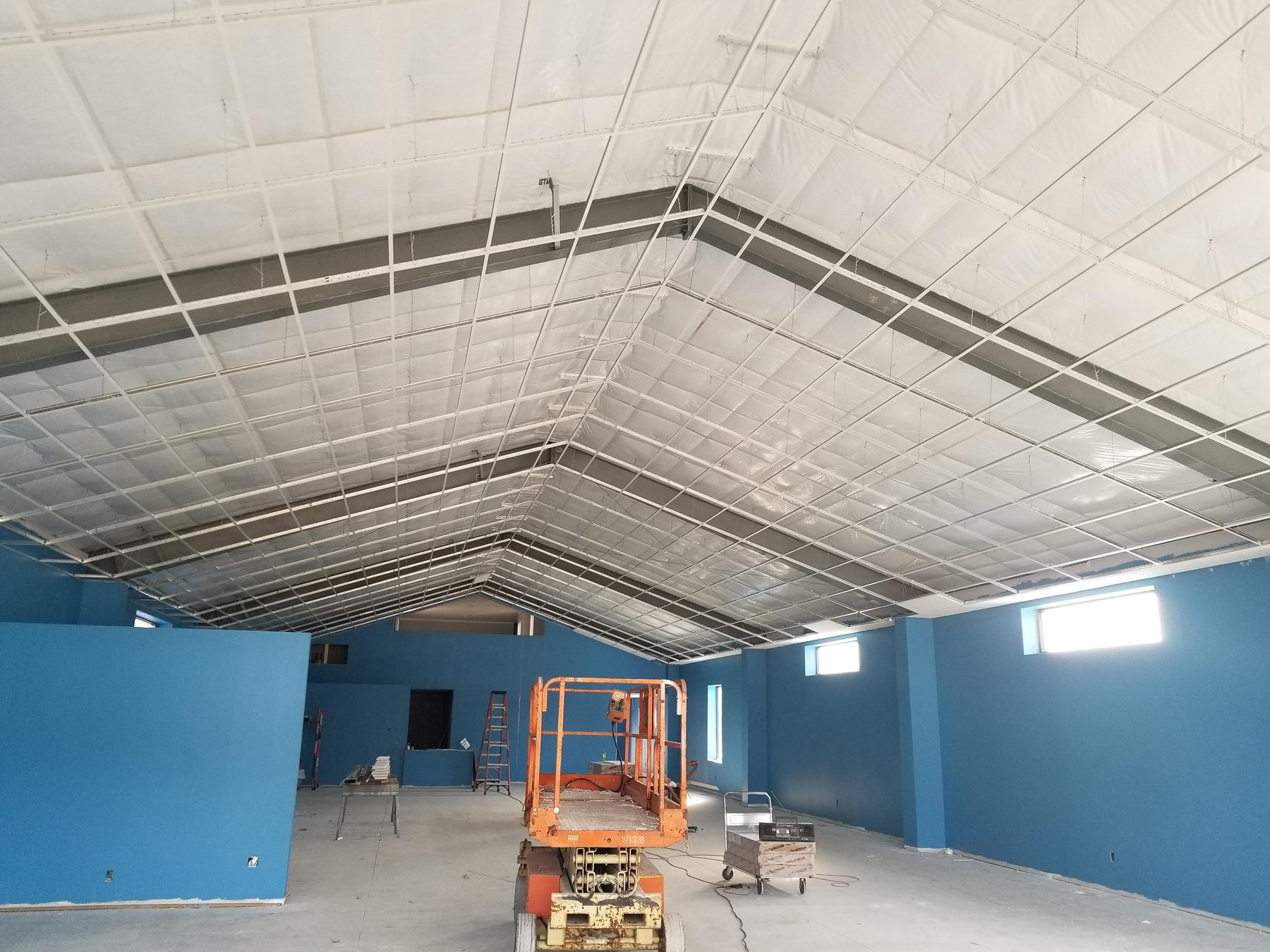 Vaulted acoustical suspension system during installation