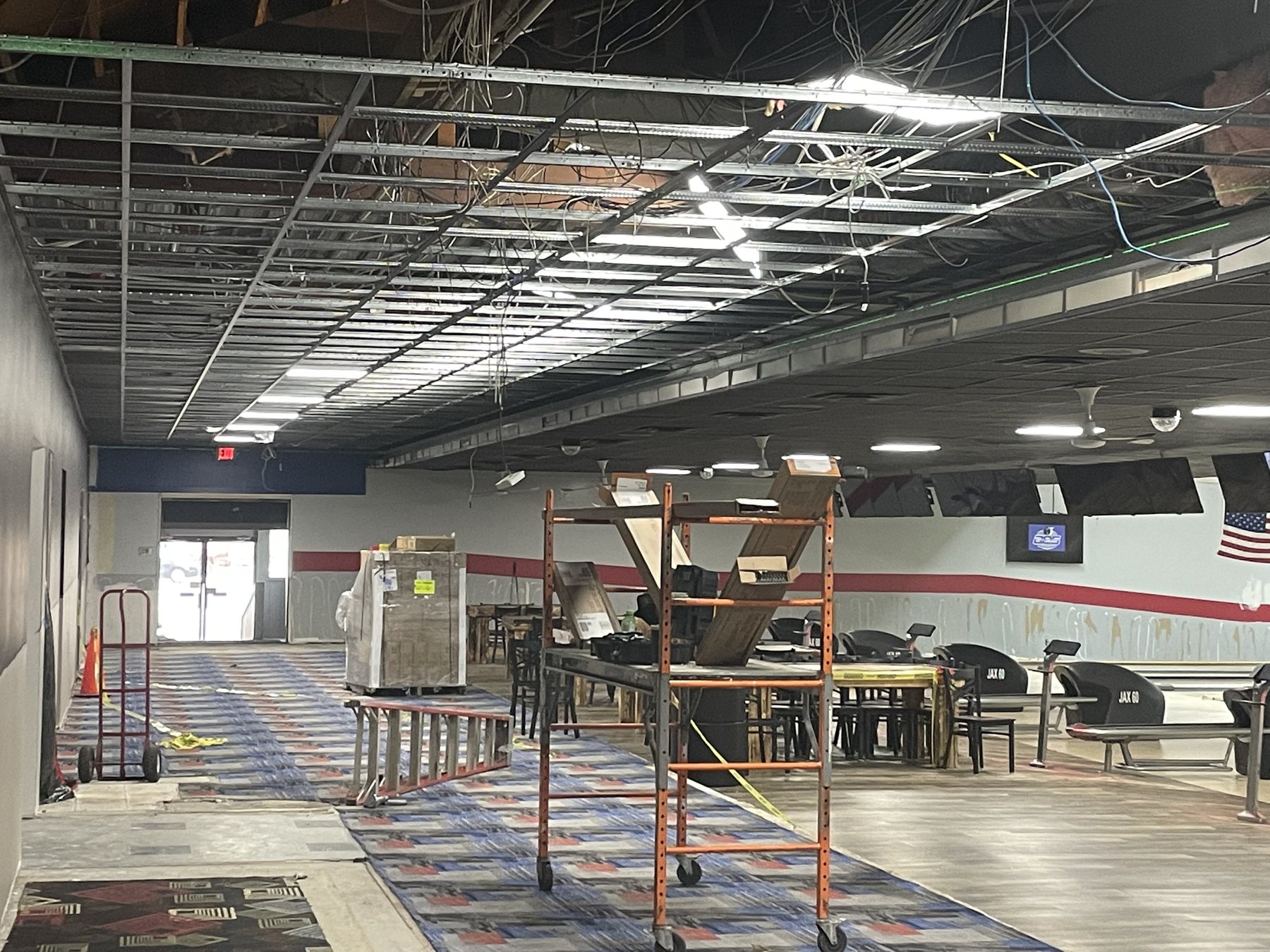 Dark commercial ceiling installation in progress