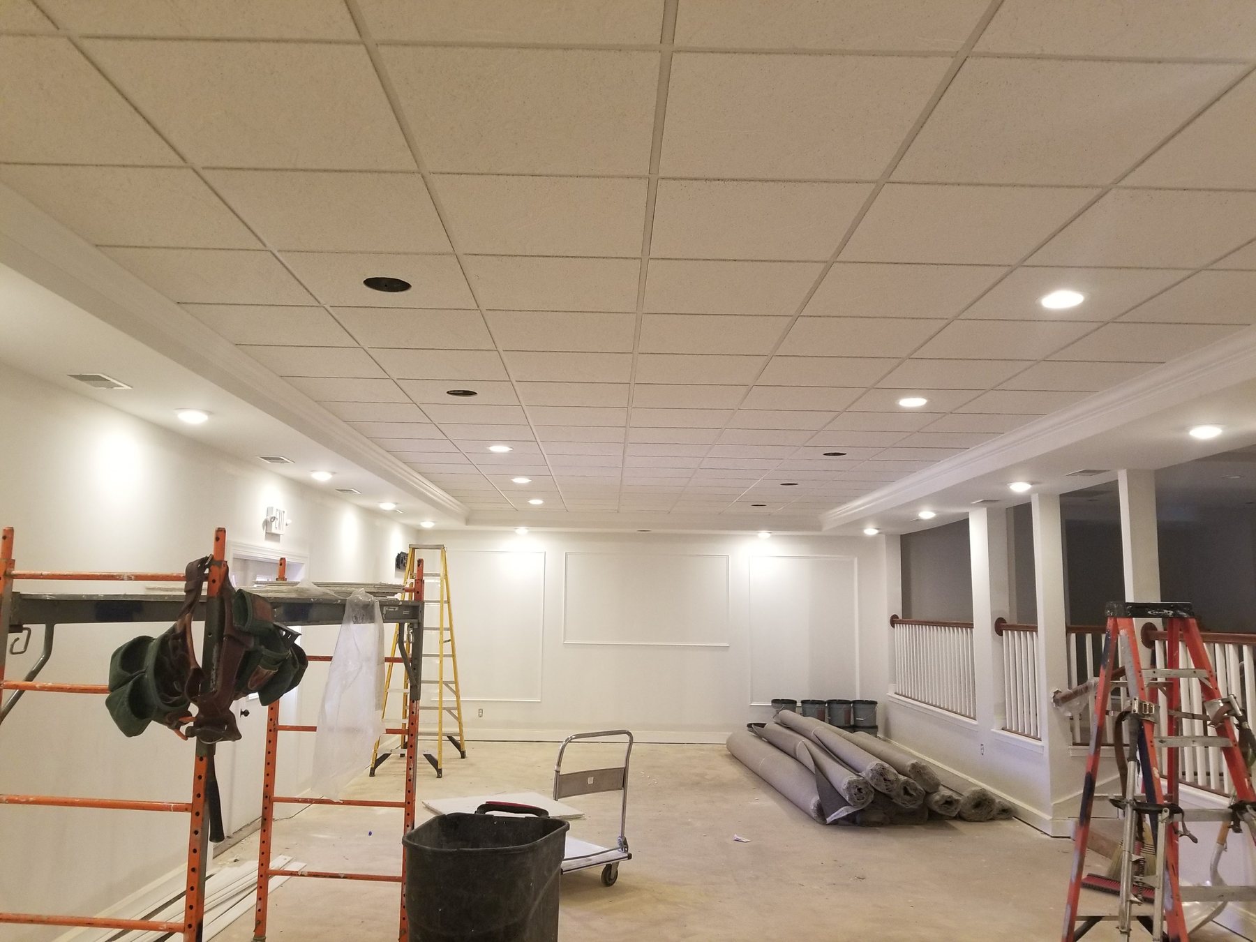 Large commercial acoustical ceiling installation in progress